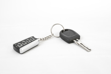 Car key and alarm system charm on a white background