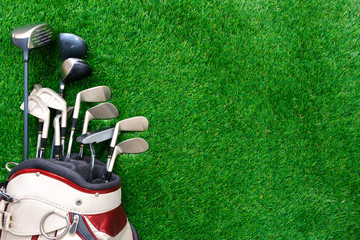Golf club in bag on green grass