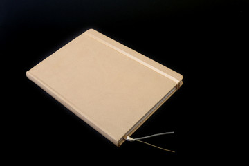 notebook and pen on white table. Selective focus