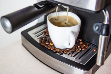 Close-up of hot coffee from coffee machine.