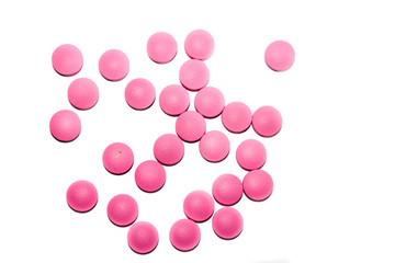 pink medical pills on white background