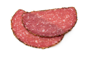 Salami slices isolated on the white background.