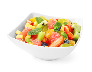 Bowl of fresh fruit salad, isolated on white