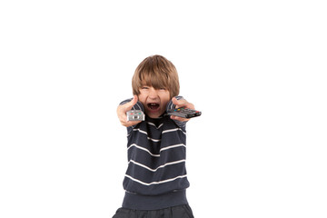 Cheerful boy with two TV remote controls. Isolated on white background