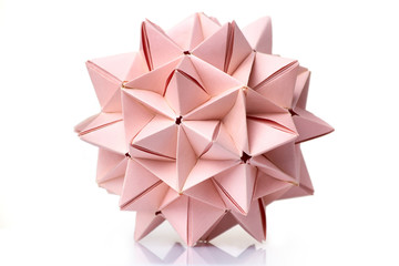 Multi piece spiky origami ball on white background. Complex geometry and advanced skills of folding paper. - obrazy, fototapety, plakaty