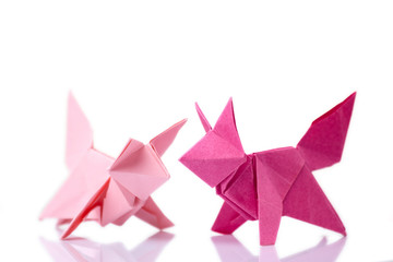 Set of animal origami models made of pink colored paper. Arts lesson, school project for exhibition.