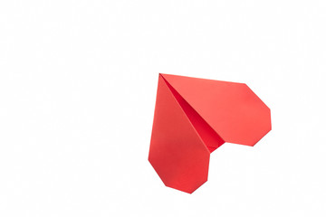 Red heart origami on white. Unusual envelope, folding paper art. Beautiful way to confess in love.