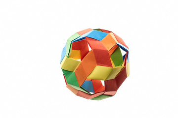 Colorful spherical origami model on white background. Multicolor kusudama ball. Difficult level of folding paper, hobby.