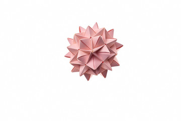 Pink spiky ball origami, isolated on white. Amazing craft made by talented kid. Kusudama ball that looks like a flower.