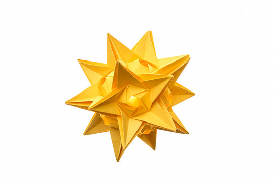 Stellated dodecahedron origami on white. Modular paper figurine made of yellow paper looks like a star.