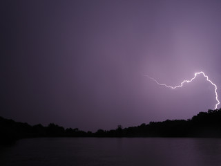 Lightning at the night lake