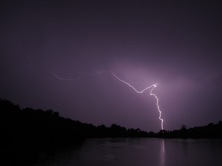 Naklejka na ściany i meble Lightning at the night lake