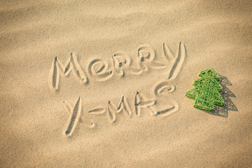 text with christmas in the sand beach