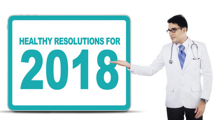 Asian doctor showing a board on studio