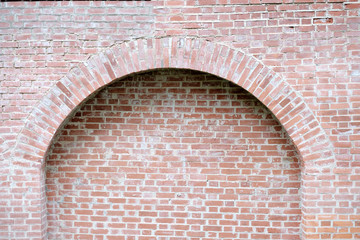 Arch od red brick wall