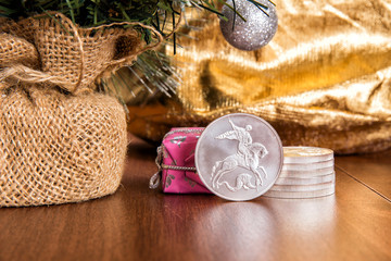 Silver coin three rubles - St. George Shoots the Dragon. Toys and decorative box on the Christmas...