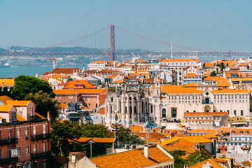 Fototapeta na wymiar Aerial View Of Downtown Lisbon Skyline Of The Old Historical City And 25 de Abril Bridge (25th April Bridge) In Portugal