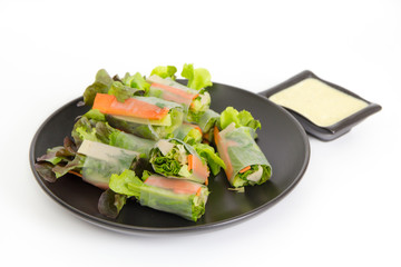 Fresh spring roll included green oak lettuce, carrot, cucumber and meat on white background