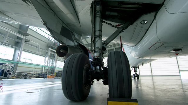 Front landing gear of big passenger aircraft closeup high detailed view. landing gear