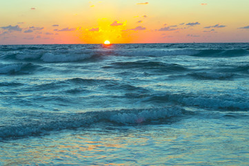 Beautiful sunset on the shtormy sea