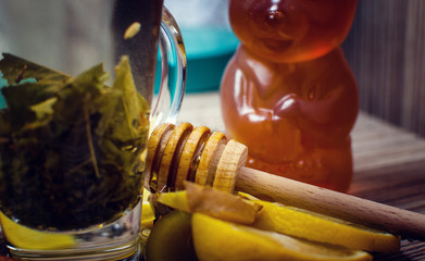 Fototapeta na wymiar Hot winter tea with lemon, honey and ginger.