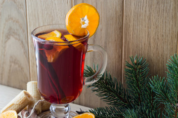 Hot Christmas wine and spices. Close-up. Place for the inscription. Selective focus.