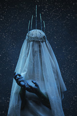 The woman personifying evil beggining fierce cold of winter. Corona on a head