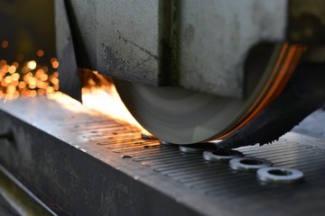 metalworking industry: finishing metal working on horizontal surface grinder machine with flying...