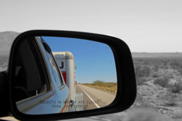 PHOENIX AZ - OCTOBER 04: car side mirror with view  U-Haul behind Phoenix Arizona 2013