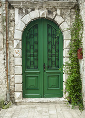 Fototapeta na wymiar a Big old green door in Rovinj, Croatia