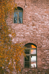 reflection of sunset on old brick building