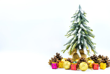 Christmas or New Year background with pine cones,gift box,golden ball and pine tree of Xmas decorations and fir branches, flat lay, blank space for a greeting text on white