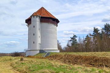 Fototapeta na wymiar White tower of hydroelectricity in Poland
