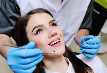 beautiful girl in the dental chair on the examination at the dentist