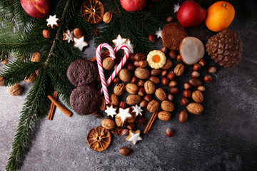 Decoration with christmas cookies. Typical cinnamon stars with fruits and nuts.