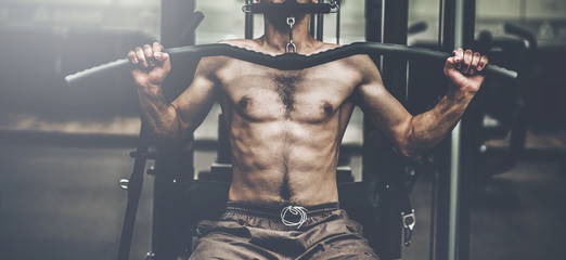 bodybuilder guy in gym pumping up hands
