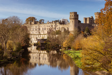 Warwick castle on the river Avon warm autumn day fall colours, Warwick, Warwickshire, England, UK,...