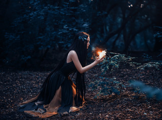 A fabulous, forest nymph with long hair found a flaming, fiery flower, with which little...