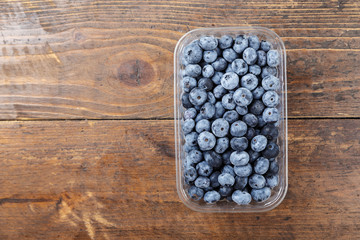 bog whortleberry on a wooden background