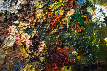 Background of a palette with a mixed oil paint