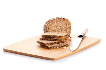 Sliced  bread on cutting board. knife and bread