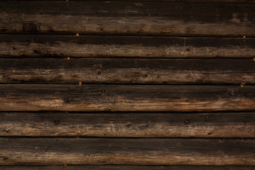 Obraz premium Decorative dark brown wooden slabs. Wood background