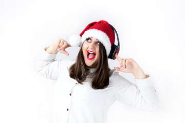 Spirit of Christmas thick girl in Santa Claus cap model XXL, woman plus size in lingerie fat Santa listen music with headphones