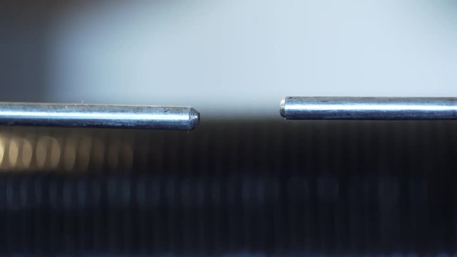 slow motion macro of a high voltage spark gap transmitter
Note: this is real spark, not CG