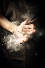 Obraz na płótnie Canvas Hands clapping with flour