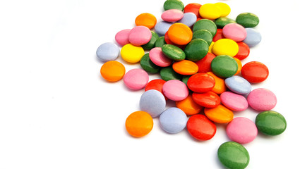 Colorful chocolate candies on white background
