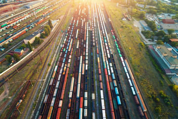 Top view of colorful cargo trains. Aerial view from flying drone of colorful freight trains on the...