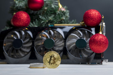 биткоин монета лежит на видеокарте под...