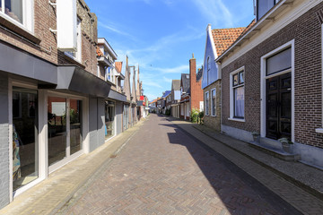 Fototapeta na wymiar View at shopping street in Den Burg village on the wadden island Texel during Summer.