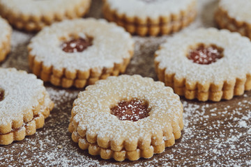 Close up of freshly baked homemade Christmas sugar cookies with jam